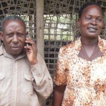 Two poultry farmers - a husband and wife team - at their farm.