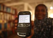 Women received advice and encouragement through the simplest of devices — their mobile phones. Photo credit: Iain Marlow