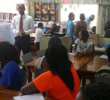 A businessman shares experiences of the world of work with young job-seekers in Micoud Public Library, St Lucia, Caribbean. A businessman shares experiences of the world of work with young job-seekers in Micoud Public Library, St Lucia, Caribbean.