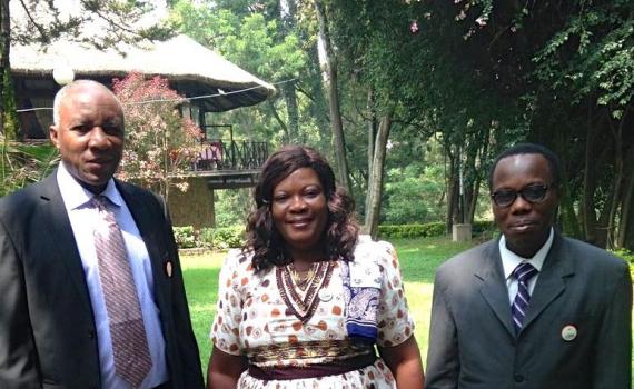 Three people - Lucy Dzandu, Simon Osei and Benjamin Folitse from the Ghana CSIR-INSTI institutional repository implementation team - standing in a garden in Addis Ababa.