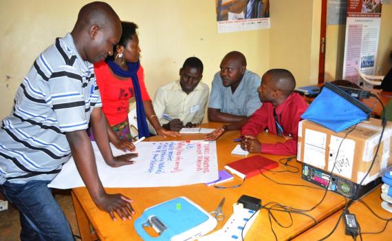 ibrarians writing on big sheets of paper during training