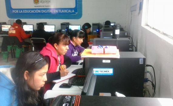 Young mothers studying on the library's computers.