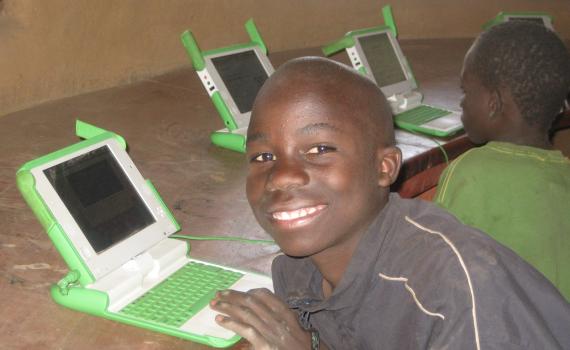 Children using laptop computers in the library. 